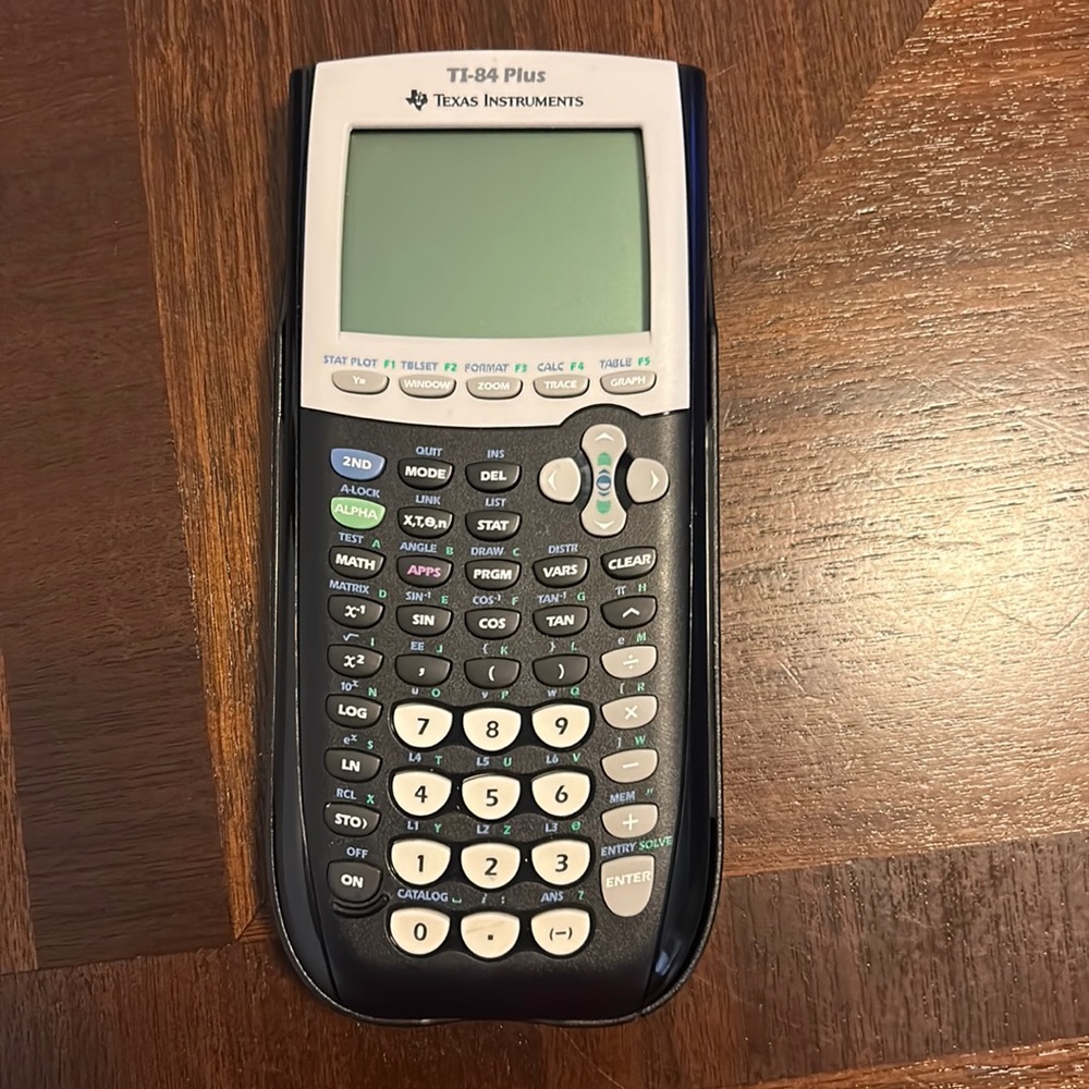 Texas Instrument TI-84 Plus graphing calculator in good condition.